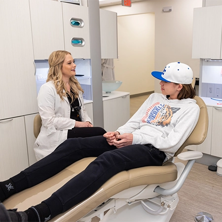 Dentist Lacy Jones At Hunt Club Family Dental Consulting With Patient